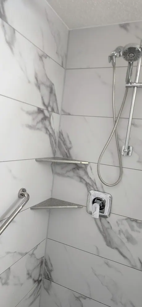 Marble-look shower with moulded corner shelves, Calgary