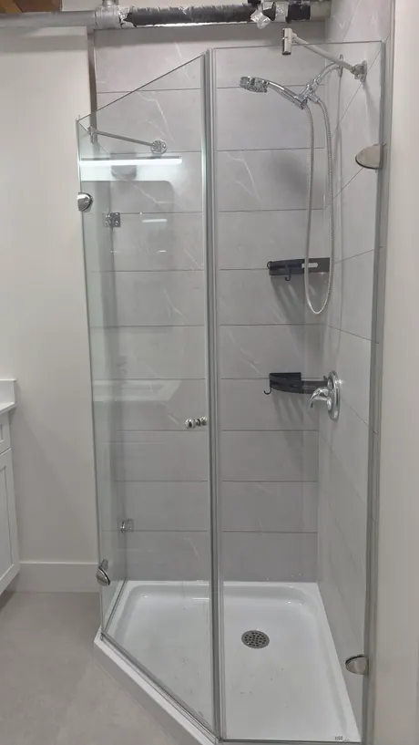 Neo-angle corner shower in grey tile-look panels, Calgary