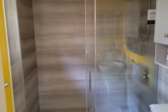 beige/grey panels- shower doors